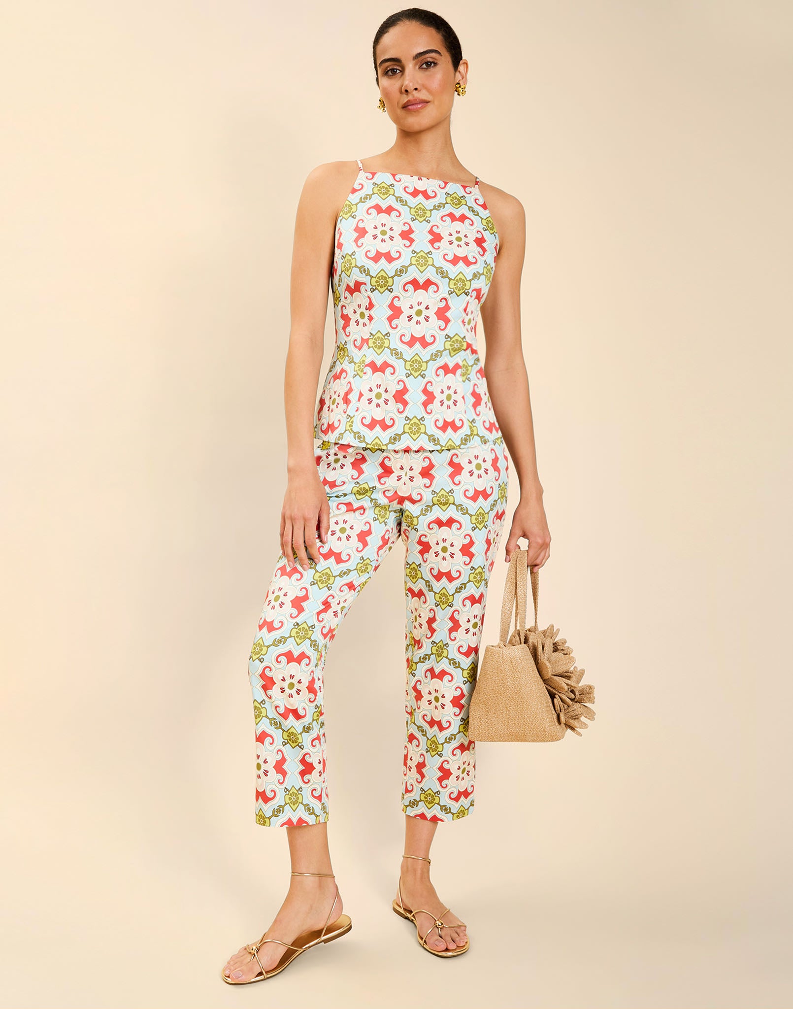Model wearing the Palau Cigarette Pant in Quatrefoil Sierra print, featuring a slim-fit cropped silhouette, tailored front pleat detailing, side seam pockets, and crisp poplin fabrication.