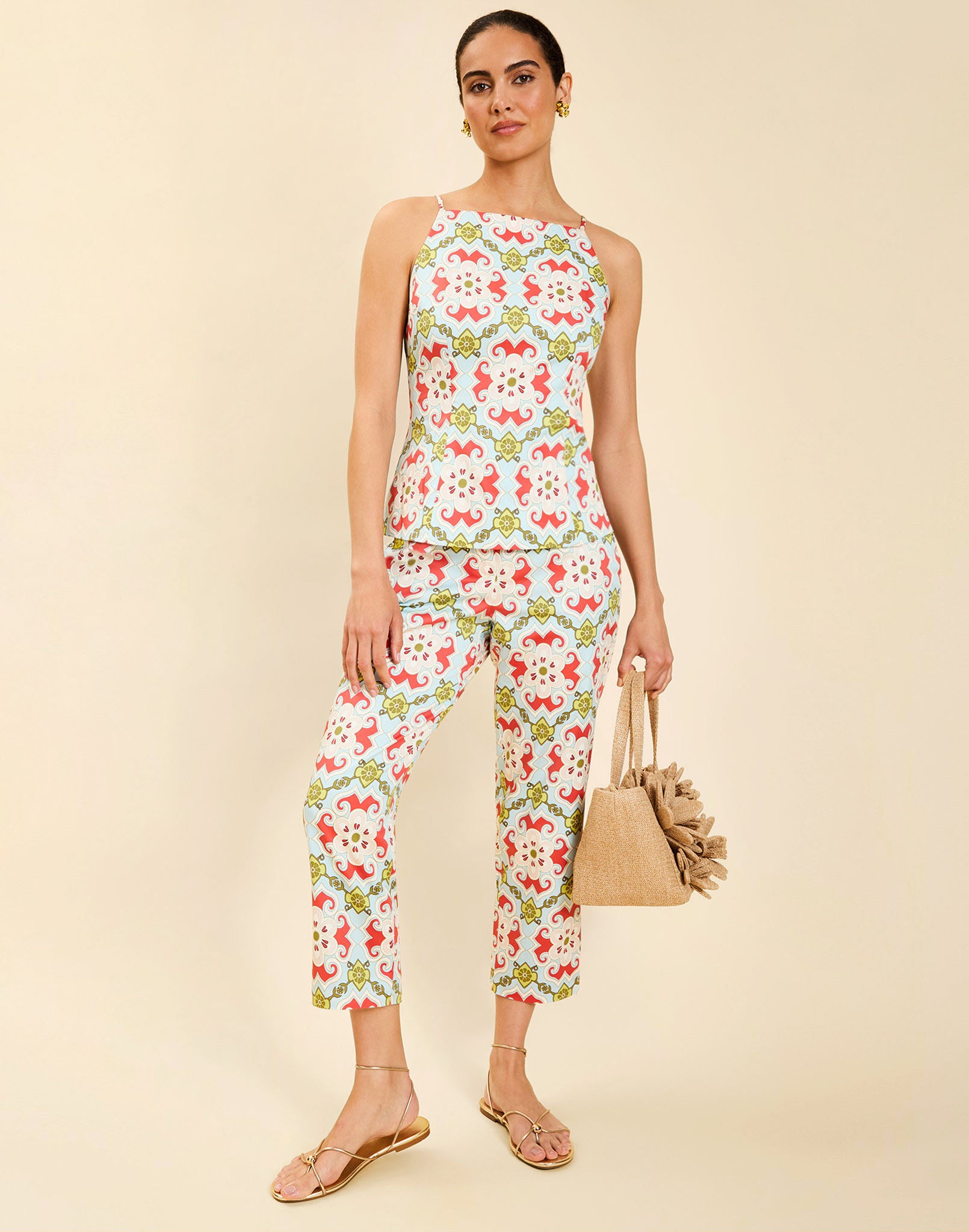 Model wearing the Palau Cigarette Pant in Quatrefoil Sierra print, featuring a slim-fit cropped silhouette, tailored front pleat detailing, side seam pockets, and crisp poplin fabrication.