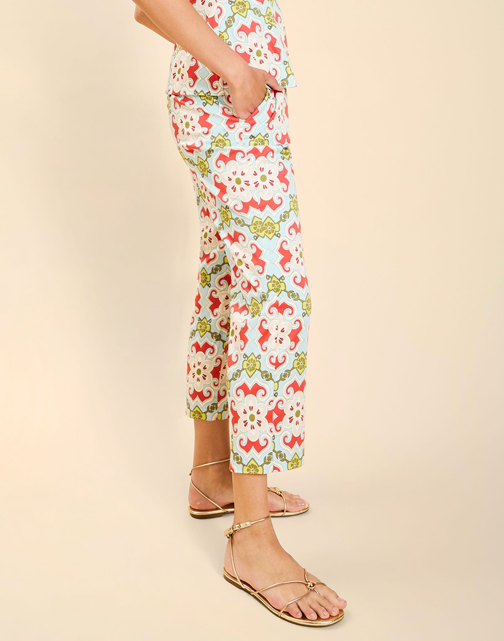 Model wearing the Palau Cigarette Pant in Quatrefoil Sierra print, featuring a slim-fit cropped silhouette, tailored front pleat detailing, side seam pockets, and crisp poplin fabrication.