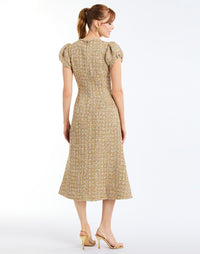 Perla Midi Dress in Gold Multi back – fit-and-flare cocktail midi with puff sleeves, rhinestone bow, crew neckline, and metallic tweed finish by Mestiza New York.
