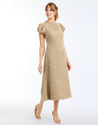 Perla Midi Dress in Gold Multi full body – fit-and-flare cocktail midi with puff sleeves, rhinestone bow, crew neckline, and metallic tweed finish by Mestiza New York.