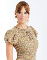 Perla Midi Dress in Gold Multi detail – fit-and-flare cocktail midi with puff sleeves, rhinestone bow, crew neckline, and metallic tweed finish by Mestiza New York.