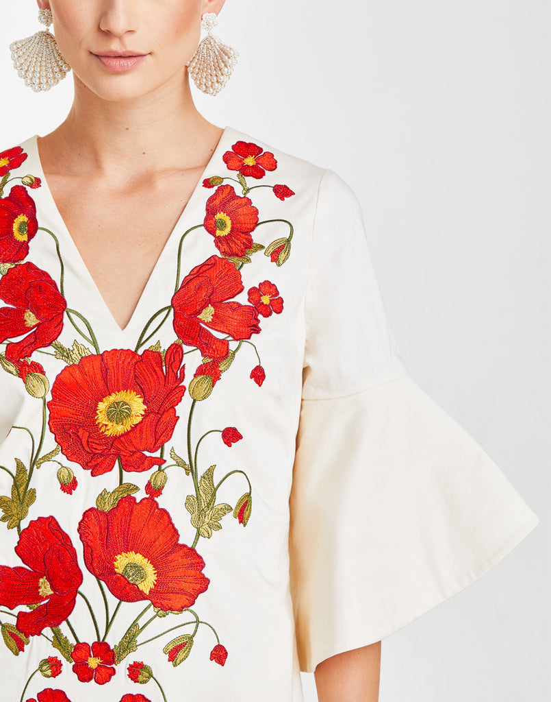 Ivory caftan with ornate poppy flower embroidery