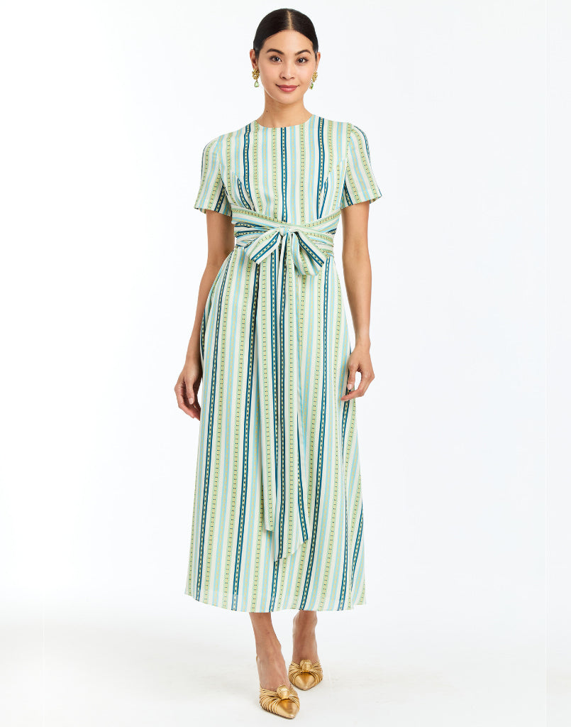 Front - Nolita Wrap Dress in Catena Stripe cocktail midi with faux wrap waist, gold hardware, and short sleeves.