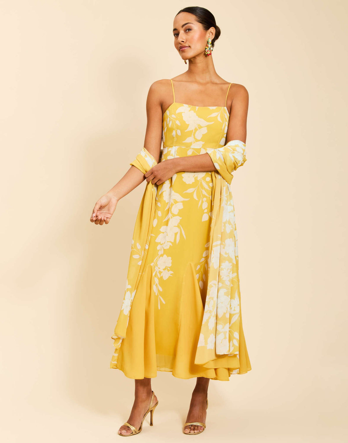 Reverie Maxi Dress in Huckleberry Yellow chiffon with trumpet silhouette, scarf sash, empire waist, adjustable straps, and side pockets.