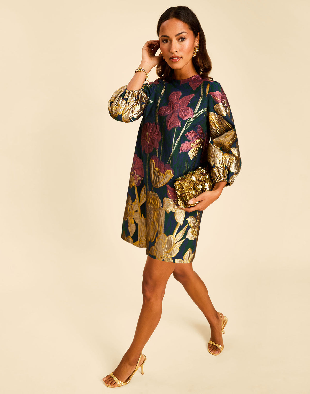 Meet the Rosanna Mini Dress in Demitasse Flowers, a jacquard A-line shift silhouette featuring balloon sleeves and a self-tie back bow.
