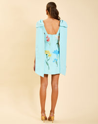 Samar Mini Dress in Blue Waltz moire with removable bow straps, floral embroidery, sweetheart neckline, and bell-shaped silhouette.