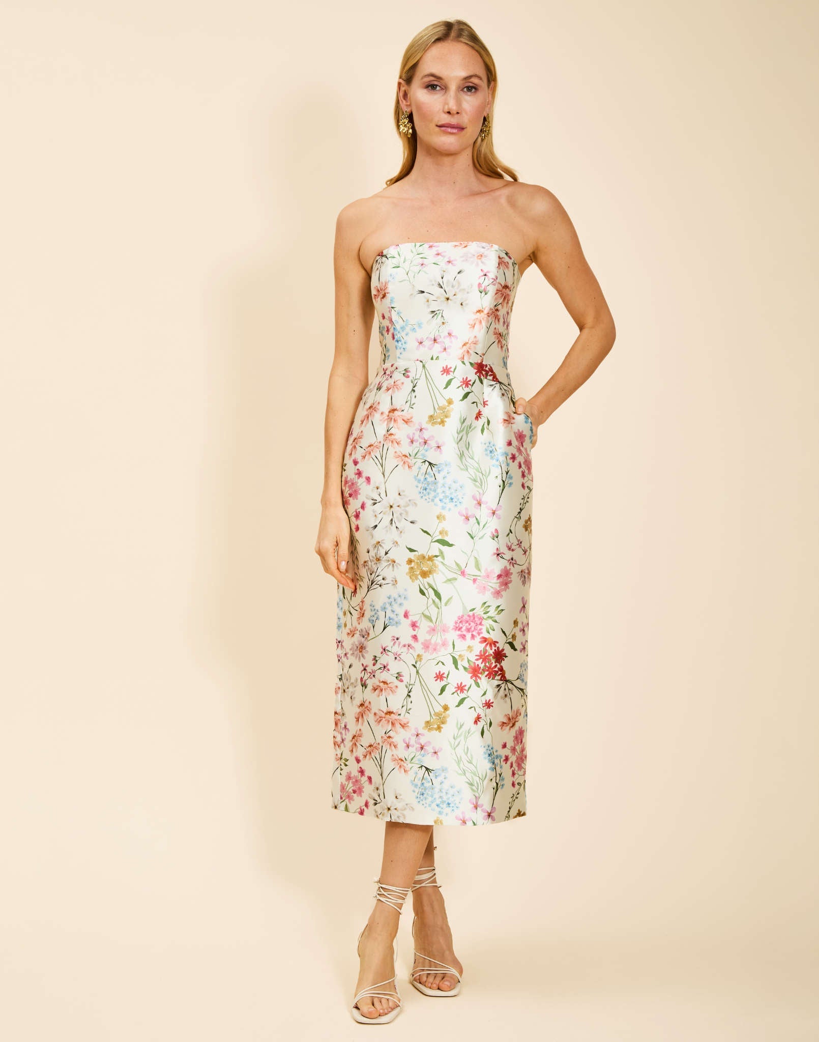 Sabrina Midi Dress in Ivory Floral poly silk twill with strapless straight neckline, pegged column silhouette, and side pockets.