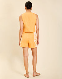 Matteo Embroidered Shorts in Blushed Citrus linen with embroidery, high waist, and wide-leg short silhouette.