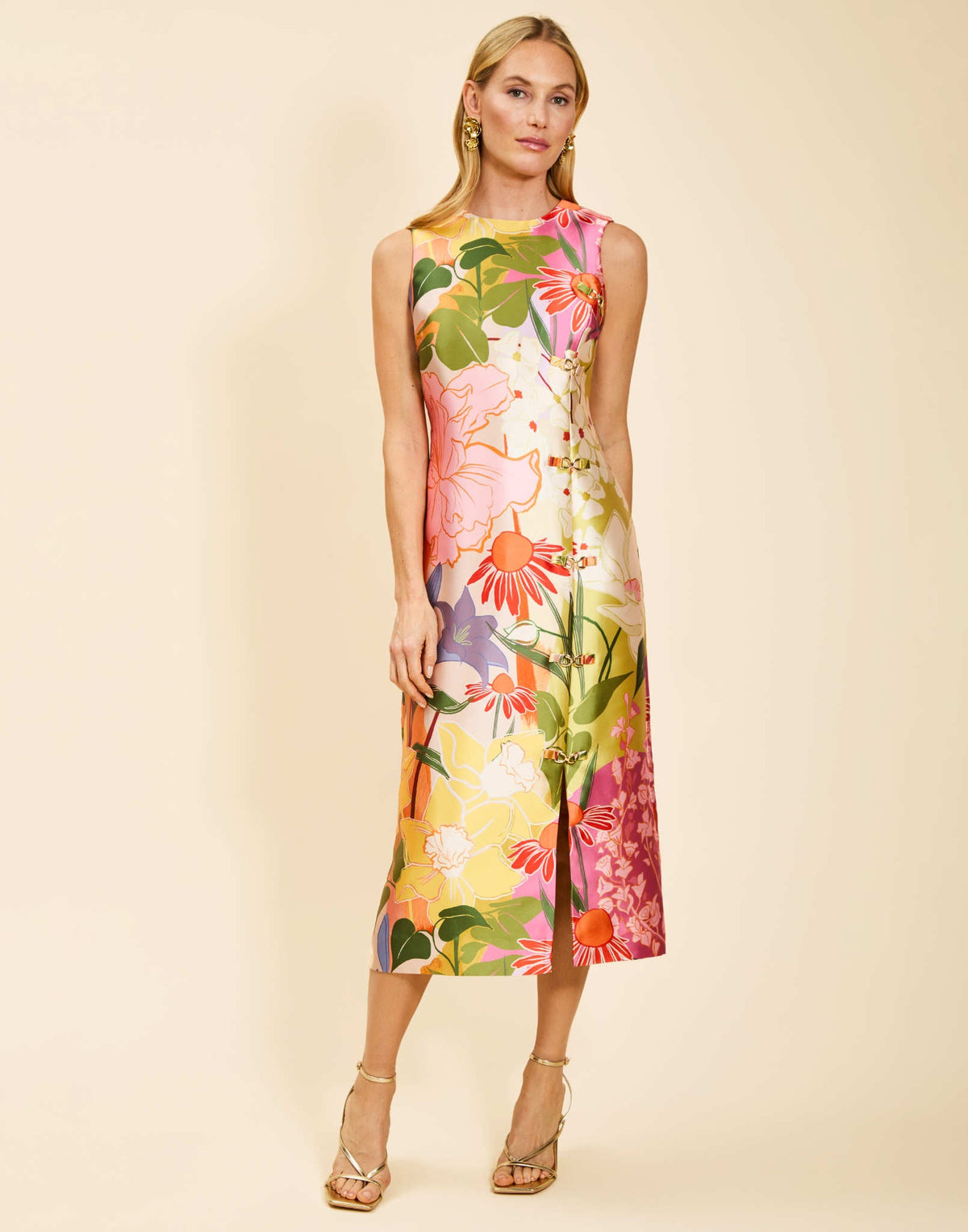 Serena Midi Dress in Primrose Midnight poly silk twill with asymmetrical front panel, gold hardware detail, column silhouette, and side pockets.