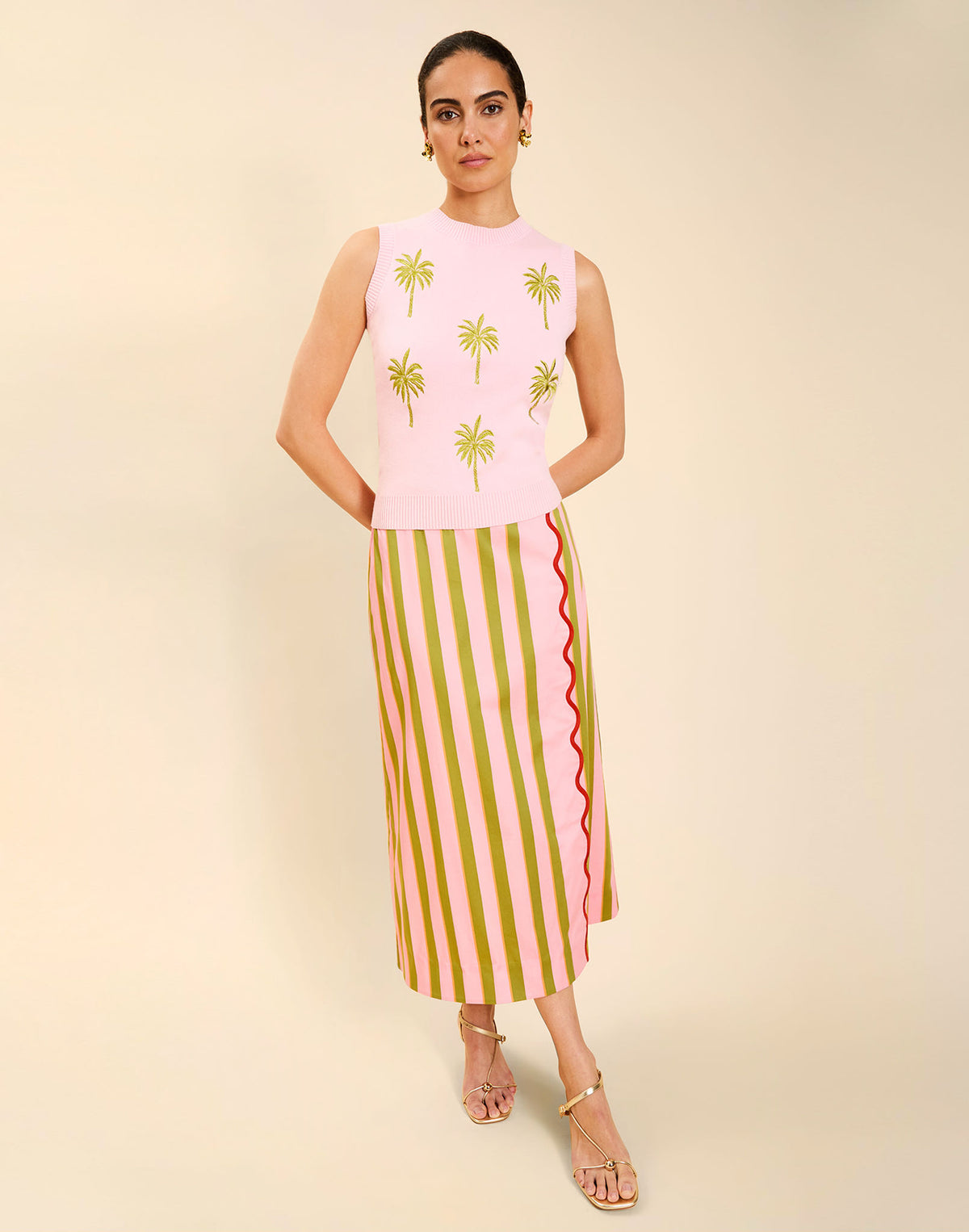 Woman wearing the Mestiza Soho Knit Shell Top in English Rose, featuring a sleeveless silhouette, crew neckline, ribbed trim, cropped fit, and soft knit fabrication.