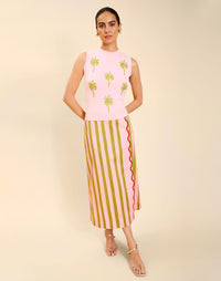 Woman wearing the Mestiza Soho Knit Shell Top in English Rose, featuring a sleeveless silhouette, crew neckline, ribbed trim, cropped fit, and soft knit fabrication.