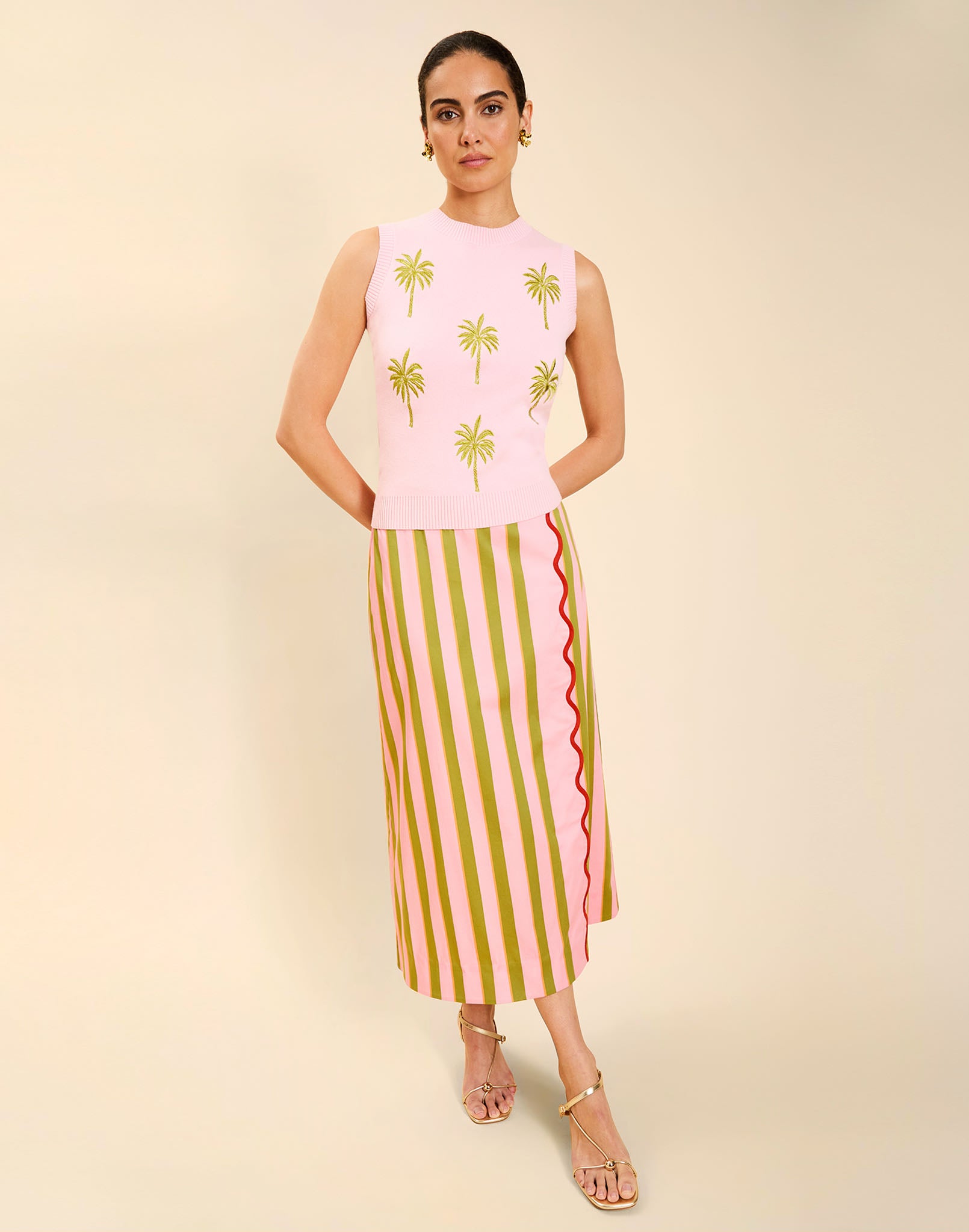 Woman wearing the Mestiza Soho Knit Shell Top in English Rose, featuring a sleeveless silhouette, crew neckline, ribbed trim, cropped fit, and soft knit fabrication.