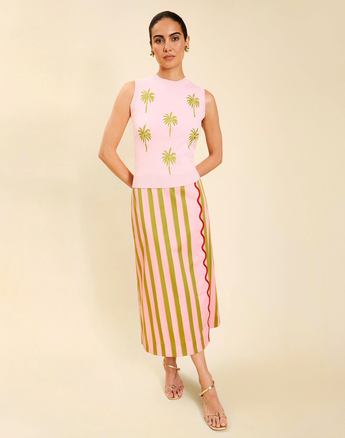 Woman wearing the Mestiza Soho Knit Shell Top in English Rose, featuring a sleeveless silhouette, crew neckline, ribbed trim, cropped fit, and soft knit fabrication.