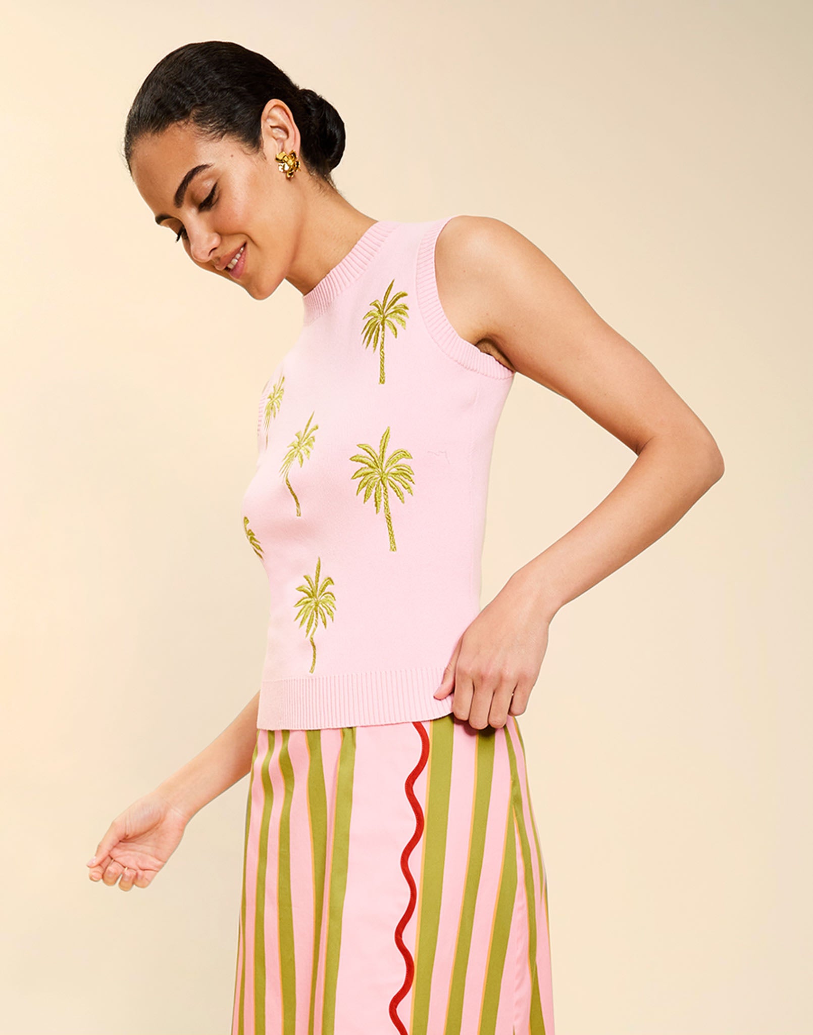 Woman wearing the Mestiza Soho Knit Shell Top in English Rose, featuring a sleeveless silhouette, crew neckline, ribbed trim, cropped fit, and soft knit fabrication.