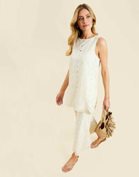 Sol Tunic Top in Ivory broderie anglaise with boat neckline, scalloped hem, and relaxed tunic silhouette.