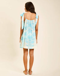 Model wearing Solenn Mini Dress in Aegean Flourish cotton voile with straight neckline and relaxed silhouette.