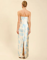 Solstice Gown in Powder Batiste poly silk twill with strapless neckline, removable pleated band, statement bow detail, and fitted gown silhouette.
