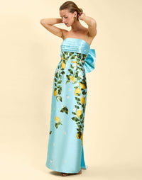 Solstice Gown in Sorrento Citrus poly silk twill with strapless neckline, removable bow, convertible bodice, and side pockets.