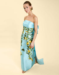 Solstice Gown in Sorrento Citrus poly silk twill with strapless neckline, removable bow, convertible bodice, and side pockets.