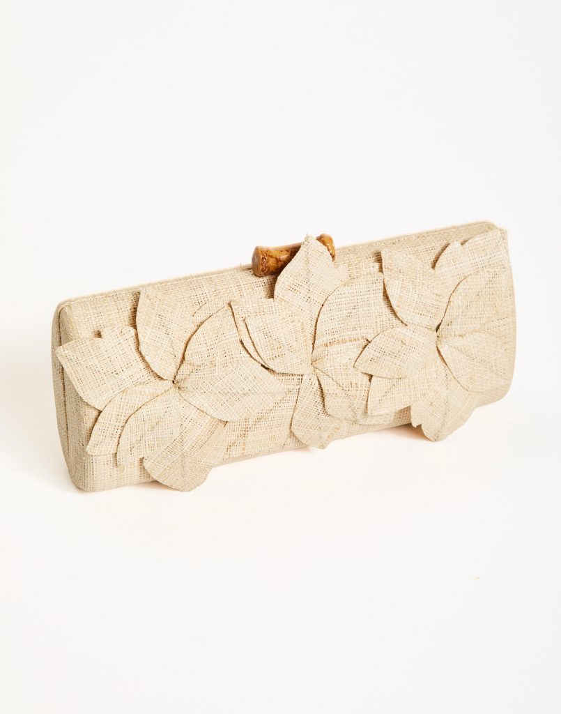 Peridot Raffia Clutch with 3D floral details, bamboo clasp, and removable gold chain strap for crossbody wear.