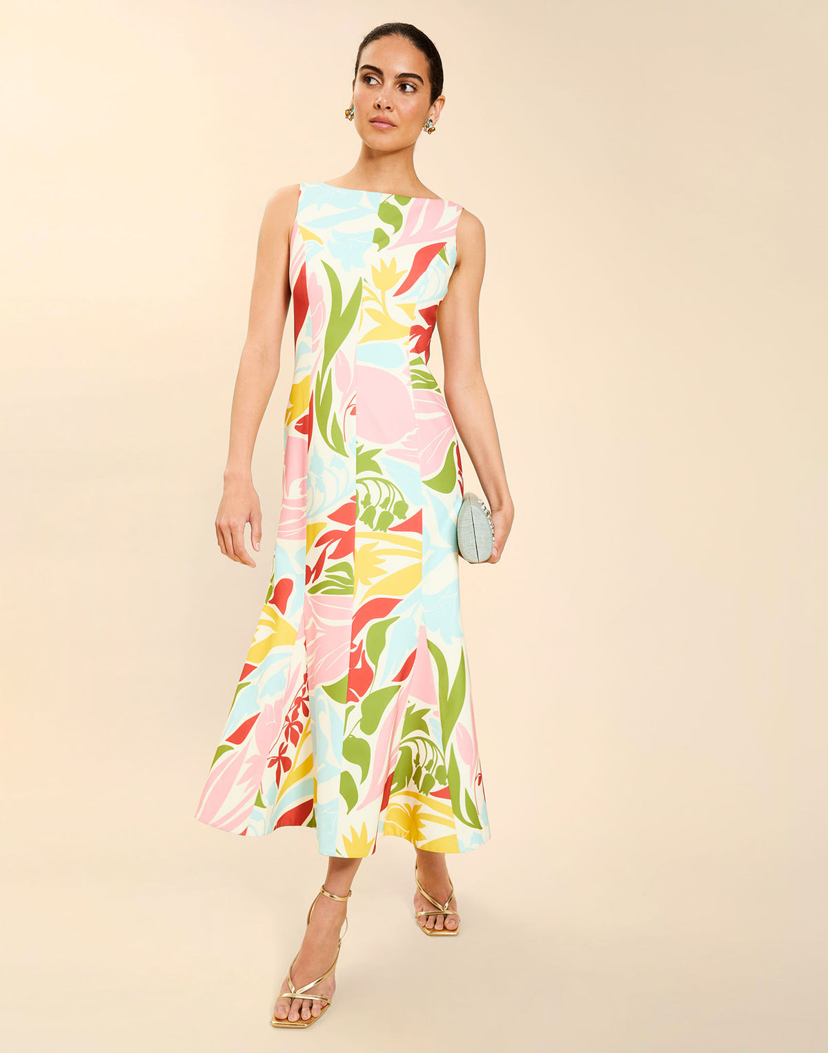 Woman wearing the Mestiza Sunnyside Convertible Midi Dress in Tuscan Daydreaming print, featuring a convertible neckline, fitted bodice, fit-and-flare skirt, and lightweight stretch crepe fabrication.
