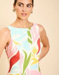 Woman wearing the Mestiza Sunnyside Convertible Midi Dress in Tuscan Daydreaming print, featuring a convertible neckline, fitted bodice, fit-and-flare skirt, and lightweight stretch crepe fabrication.