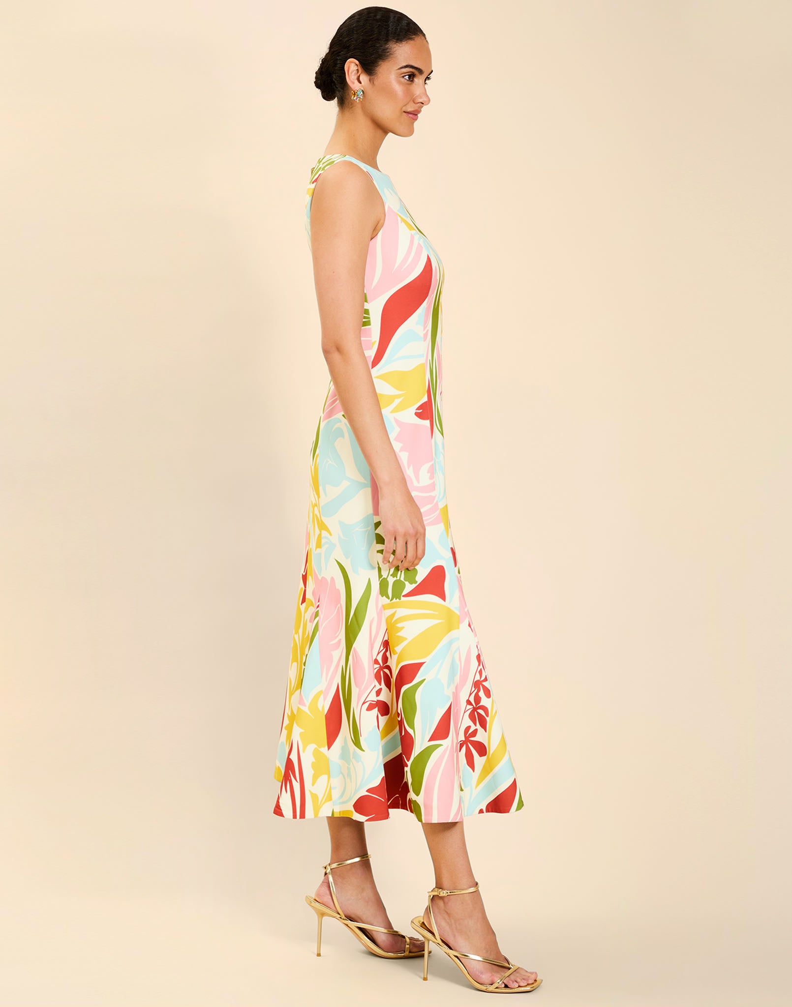 Woman wearing the Mestiza Sunnyside Convertible Midi Dress in Tuscan Daydreaming print, featuring a convertible neckline, fitted bodice, fit-and-flare skirt, and lightweight stretch crepe fabrication.