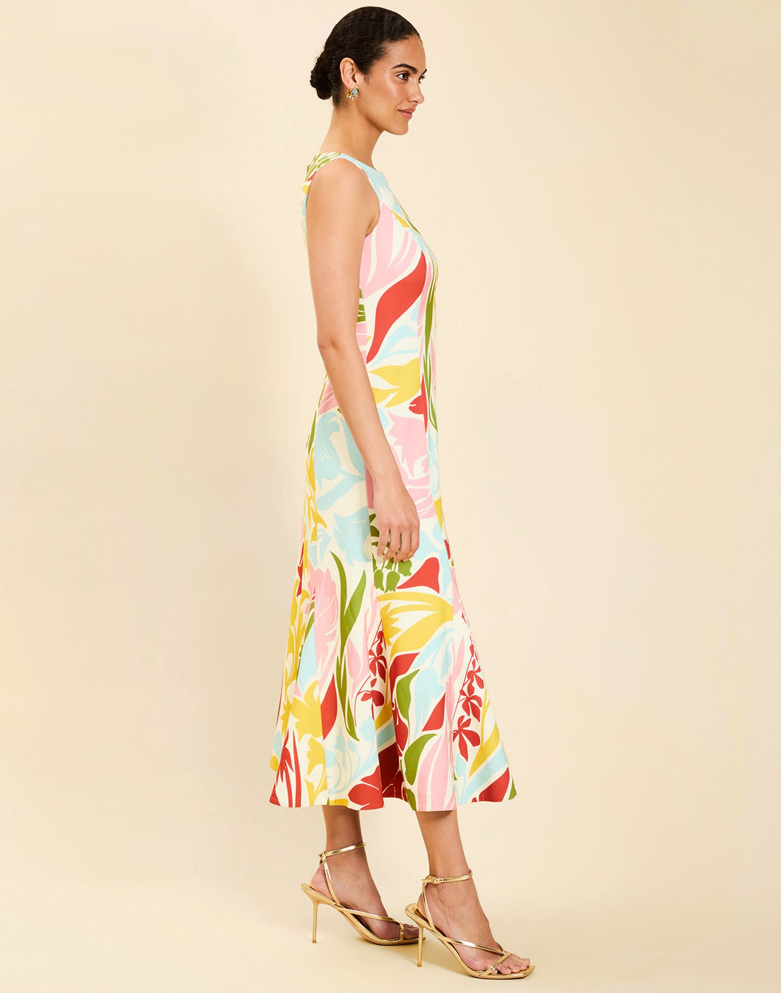 Woman wearing the Mestiza Sunnyside Convertible Midi Dress in Tuscan Daydreaming print, featuring a convertible neckline, fitted bodice, fit-and-flare skirt, and lightweight stretch crepe fabrication.