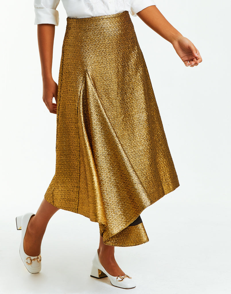 Metallic gold tweed A-line midi skirt with draping design on side.