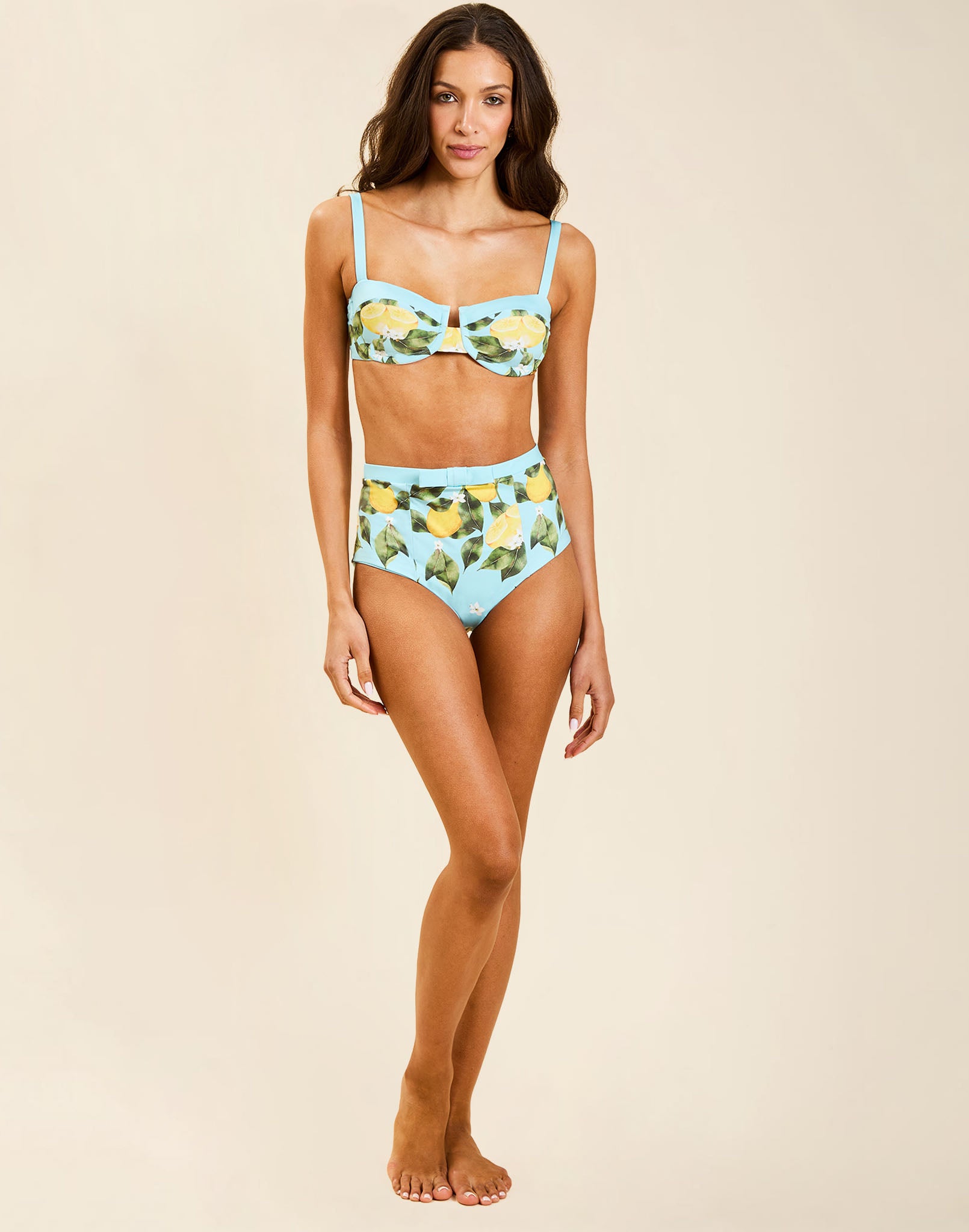 Model wearing Tangier Balconette Bikini Top in Sorrento Citrus with V-neck shaping seams and adjustable straps.