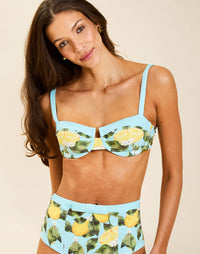 Model wearing Tangier Balconette Bikini Top in Sorrento Citrus with V-neck shaping seams and adjustable straps.