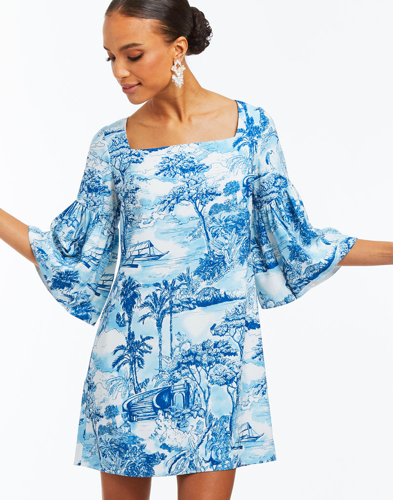 Blue and white tropical toile print mini dress with ¾ length bell sleeves with ruffle detail. 
