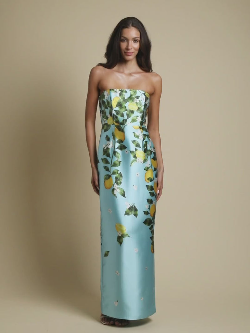 Solstice Gown in Sorrento Citrus poly silk twill with strapless neckline, removable bow, convertible bodice, and side pockets.